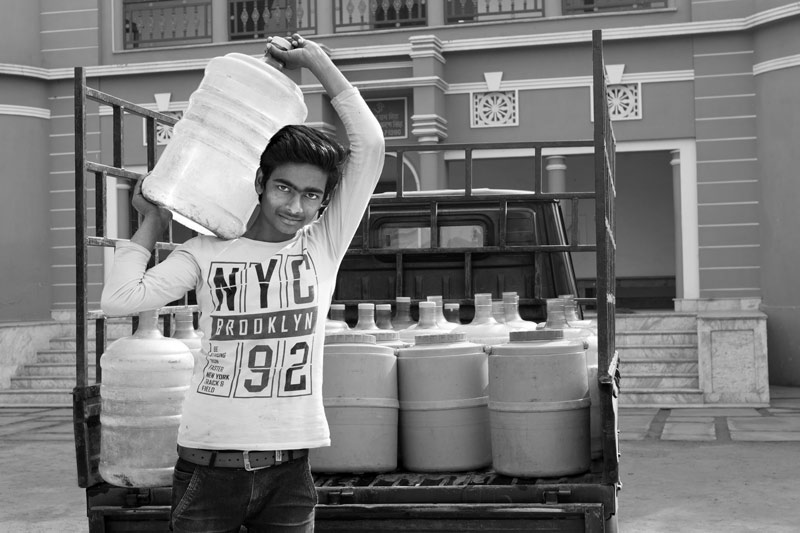 Human Right to Water in India - A local vendor distributing treated packaged water for a price from a Reverse-Osmosis (RO) plant in Bhojpur district, Bihar
